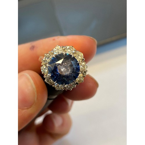 227 - A sapphire and diamond ring, the round cut sapphire weighing 5.10 carats approx. (10.7 x 10.7 x 6.0 ... 