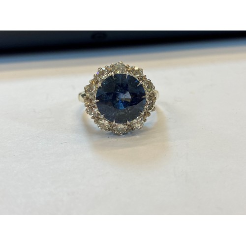 227 - A sapphire and diamond ring, the round cut sapphire weighing 5.10 carats approx. (10.7 x 10.7 x 6.0 ... 