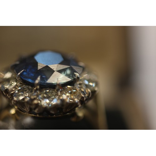 227 - A sapphire and diamond ring, the round cut sapphire weighing 5.10 carats approx. (10.7 x 10.7 x 6.0 ... 