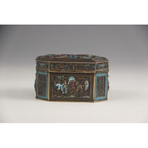 576 - A Chinese silver and enamel box, 19th century, possibly Canton, the canted rectangular box decorated... 