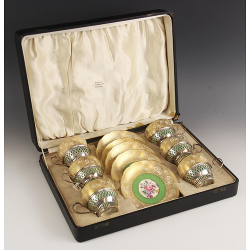 101 - A George V silver mounted cabaret set, Charles S Green and Co Ltd, London 1913, comprising six Grosv... 