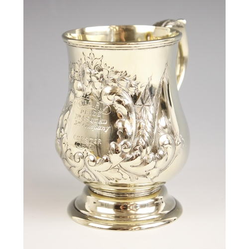 137 - A Victorian white metal military interest mug, of bell shape with scroll handle, engraved ‘6th C.R.V... 