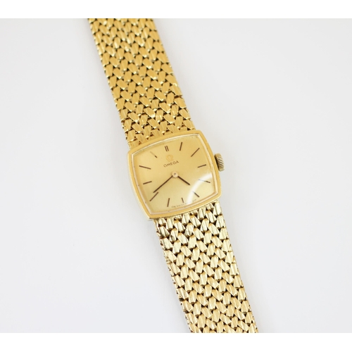 151 - An 18ct gold Omega lady’s wristwatch, the square champagne colour dial with baton markers, set to a ... 