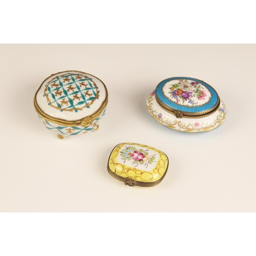 278 - A selection of three enamelled pill boxes, to include a Limoges oval example, florally decorated aga... 