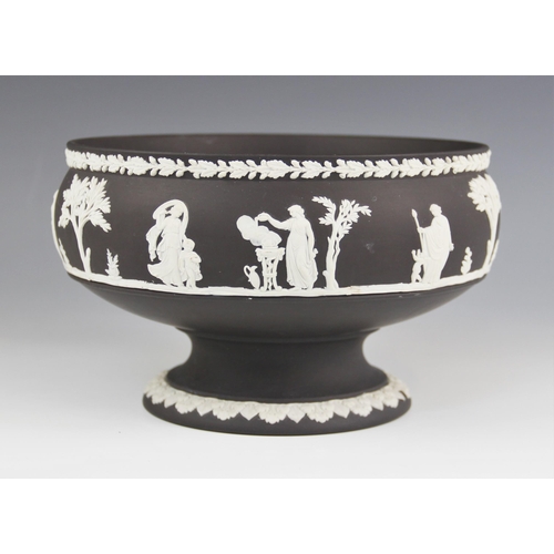 468 - A Wedgwood black basalt footed bowl, mid 20th century, the body with white jasper bas relief continu... 