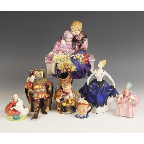 502 - A selection of Royal Doulton figures, to include; The Flower Seller's Children HN1206, printed and p... 