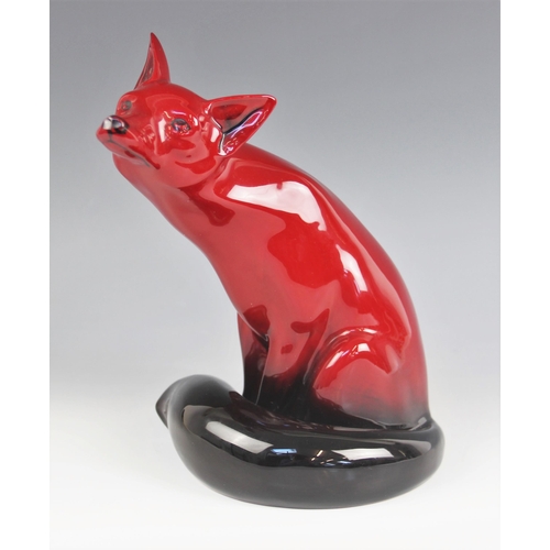 506 - A Royal Doulton Flambe fox of large proportions, modelled seated and looking skywards, 24cm high