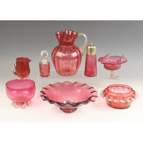 526 - Eight pieces of Victorian and later cranberry glass, comprising: a water jug of lobed baluster form,... 