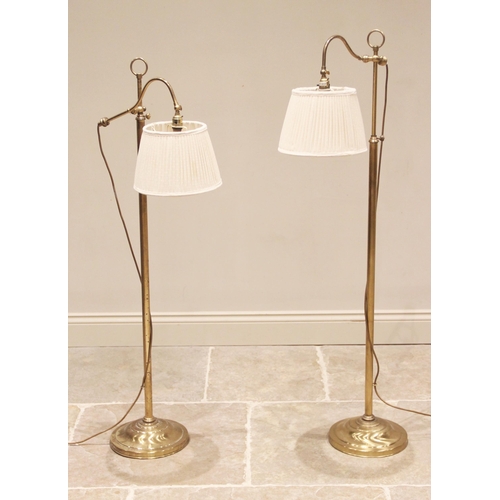 534 - Christopher Wray, London, a pair of lacquered brass floor standing reading lamps, late 20th century,... 