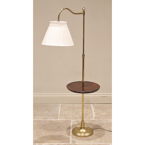 535 - A lacquered brass floor standing reading lamp/table, late 20th century, the adjustable arm upon an e... 