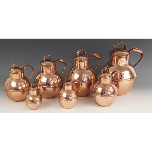 546 - An associated set of graduated copper Guernsey cream jugs by Martin's, each of typical form with app... 