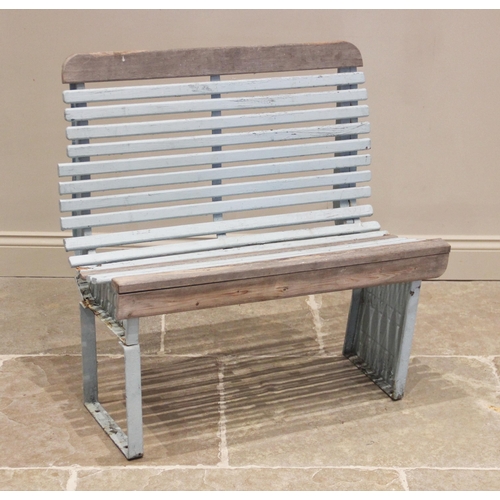 554 - A painted slatted tram bench, early 20th century, of curved form, the slats mounted upon iron uprigh... 