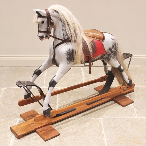 557 - A dapple grey 'coach sprung' rocking horse in the manner of F H Ayres, early 20th century, modelled ... 