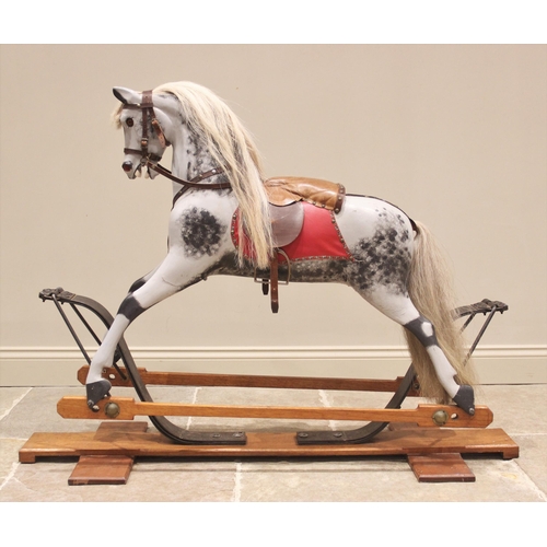 557 - A dapple grey 'coach sprung' rocking horse in the manner of F H Ayres, early 20th century, modelled ... 