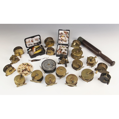 576 - A collection of eighteen brass fishing reels, early 20th century and later, two examples stamped 'He... 