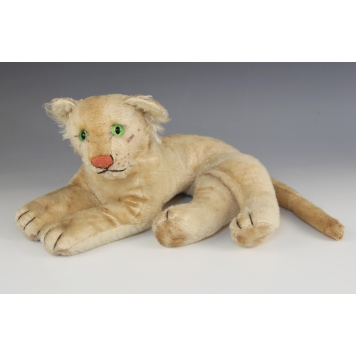 593 - A Steiff lion cub, mid 20th century, with green glass eyes, pink stitched nose and silver coloured e... 