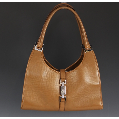 610 - A Gucci 'Jackie' handbag, the tan pebbled leather bag, with silver tone hardware and double top hand... 