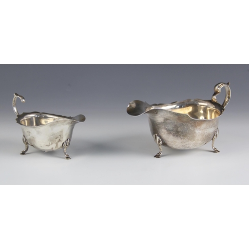 70 - A George V silver sauce boat, Adie Brothers Ltd, Birmingham 1925, with scroll handle upon three shel... 