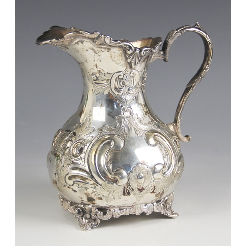 71 - An Edwardian silver milk jug, Johnson, Durban and Co Ltd, Birmingham 1904, the cast scrolling rim ab... 