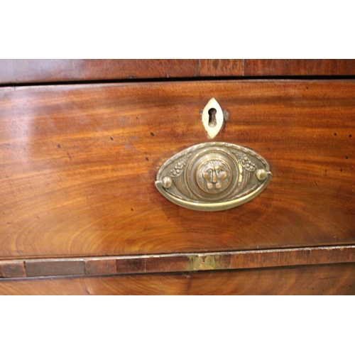 766 - An early 19th century mahogany chest of drawers, the inlaid frieze over an arrangement of two short ... 