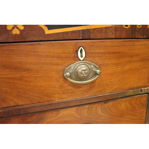 766 - An early 19th century mahogany chest of drawers, the inlaid frieze over an arrangement of two short ... 