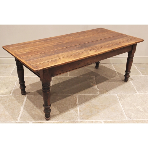 767 - A Victorian stained pine kitchen/scullery work table, the cleated plank top over a faux drawer, upon... 