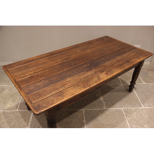 767 - A Victorian stained pine kitchen/scullery work table, the cleated plank top over a faux drawer, upon... 