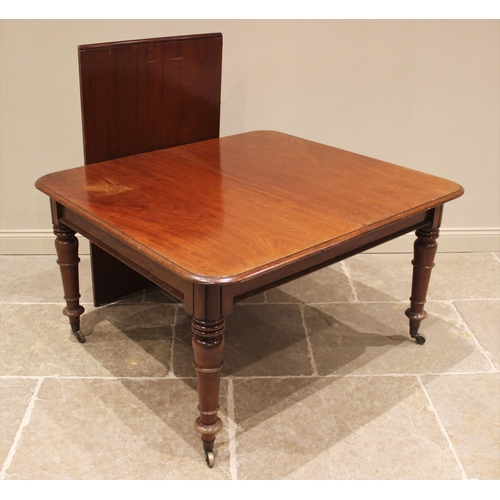 772 - A Victorian mahogany extending dining table, the rectangular moulded top with rounded corners, raise... 