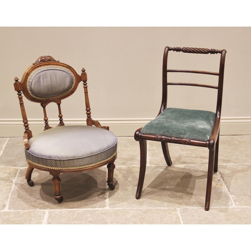 775 - A Regency mahogany dining chair, the rope twist top rail above a drop-in seat, upon sabre legs, 84cm... 