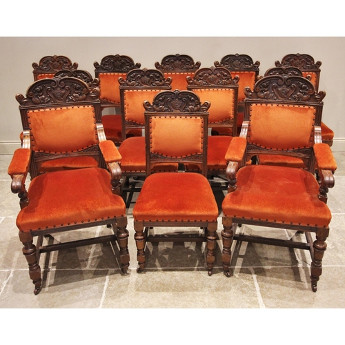 779 - A set of twelve Victorian carved walnut dining chairs, by S J Waring & Sons, Liverpool, the shaped t... 