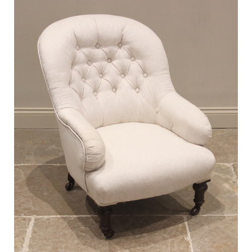 787 - A Victorian tub chair, later re-upholstered, the arched button back over a bowfront seat upon turned... 