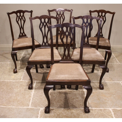 790 - A set of six Chippendale style mahogany dining chairs, early 20th century, each with a pierced splat... 