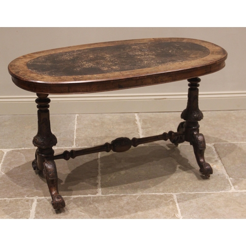 796 - A Victorian figured walnut oval centre/occasional table, the moulded top inset with a leather skiver... 