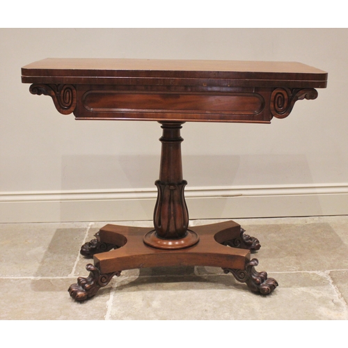 801 - A William IV mahogany games table, the rectangular folding top with rounded corners opening to a cir... 