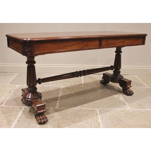 802 - A William IV mahogany library table, the moulded flame mahogany top with rounded corners above a pai... 