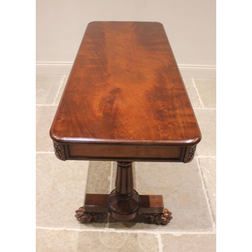 802 - A William IV mahogany library table, the moulded flame mahogany top with rounded corners above a pai... 