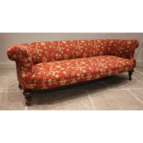 808 - A Victorian Chesterfield type settee. later re-upholstered in red foliate fabric, with deep set upho... 