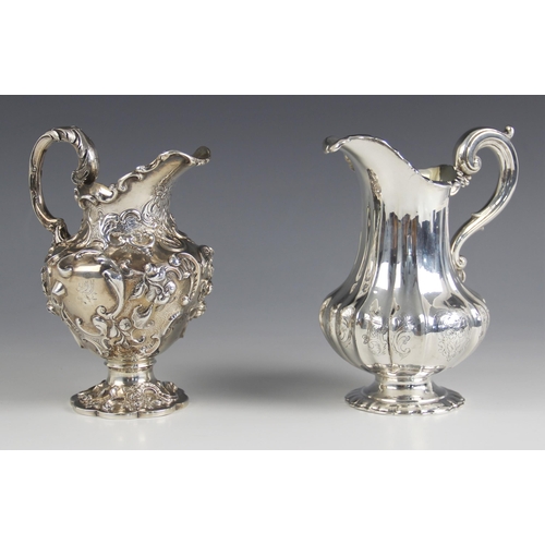 81 - A Victorian silver milk jug, possibly William Eaton, London 1845, the cast scrolling rim above an em... 