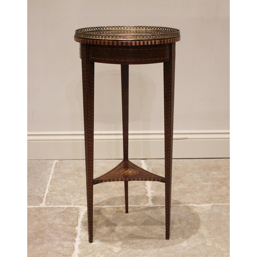 813 - A 19th century mahogany inlaid plant stand, the circular top with an openwork brass gallery, centred... 