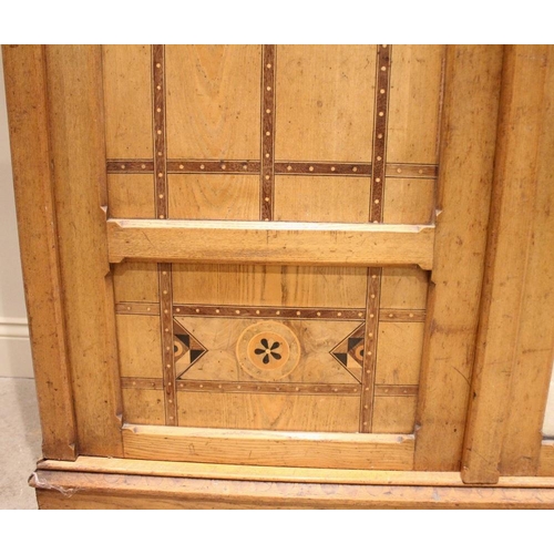 817 - An Arts & Crafts Gothic Revival ash inlaid wardrobe, attributed to Charles Bevan, possibly designed ... 