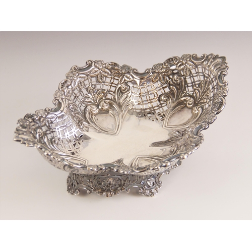 82 - An Edwardian silver dish, Mappin and Webb Ltd, Sheffield 1901, the floral and scroll embossed rim ab... 