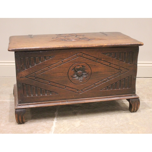 820 - A 17th century style oak blanket/storage chest, 20th century, the hinged cover carved in deep relief... 