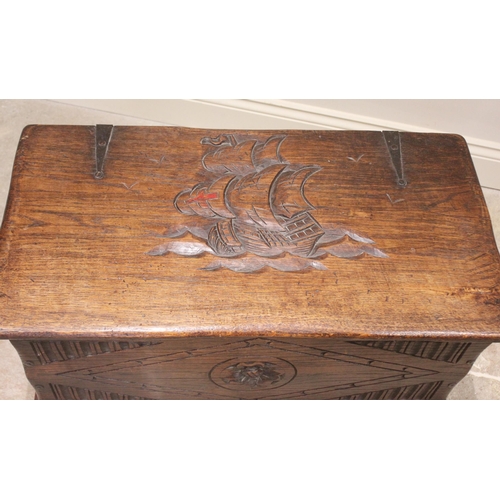 820 - A 17th century style oak blanket/storage chest, 20th century, the hinged cover carved in deep relief... 