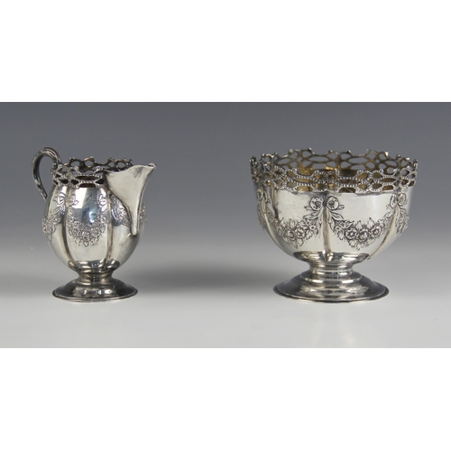 83 - An Edwardian silver cream jug and sugar bowl, Mappin and Webb Ltd, London 1902, each with  openwork ... 