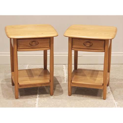 830 - A pair of Ercol 'Windsor' honey elm lamp tables, late 20th century, the figured rectangular tops abo... 