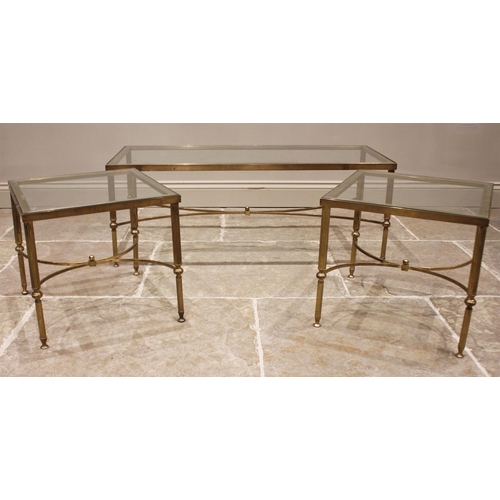 840 - A pair of glass top 'Hollywood Regency' lamp tables, mid 20th century, upon fluted cylindrical brass... 