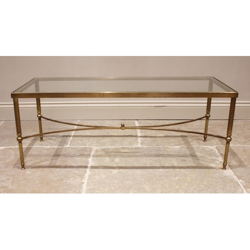 840 - A pair of glass top 'Hollywood Regency' lamp tables, mid 20th century, upon fluted cylindrical brass... 