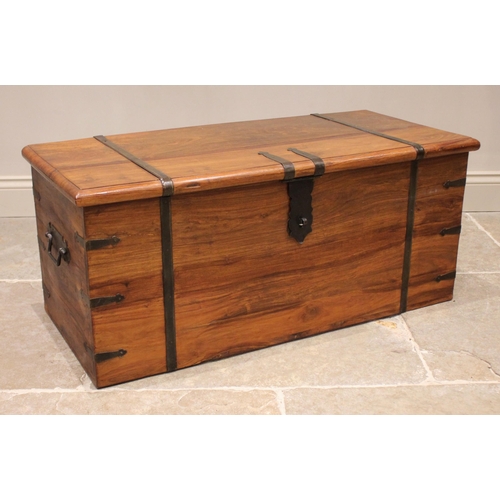 842 - A rustic hardwood blanket chest, the rectangular moulded hinged top applied with iron banding and a ... 