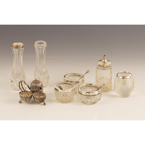 86 - A Victorian silver miniature cruet set, Thomas Walker, Birmingham 1886, with embossed reeded decorat... 