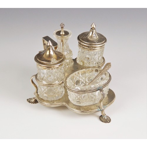 9 - A Victorian cut glass silver mounted cruet set, Henry Manton, Birmingham 1876, comprising pepperette... 